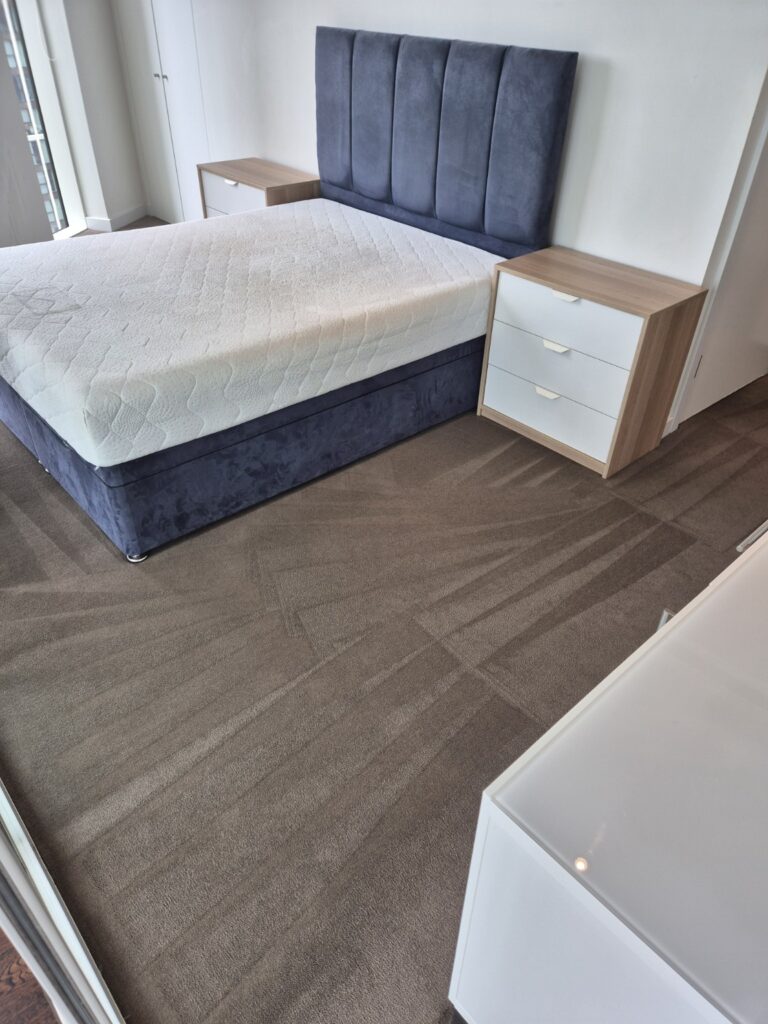 Carpet after professional hot-water extraction cleaning, showing refreshed pile and visible extraction lines